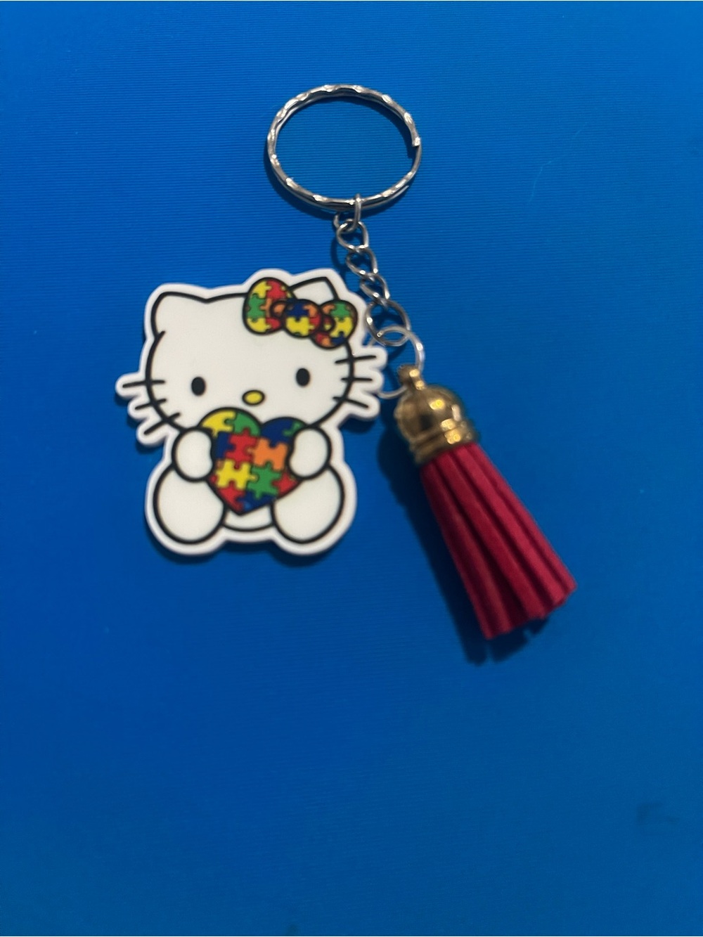 Hello Kitty Puzzle Heart Keychain with Red Tassel